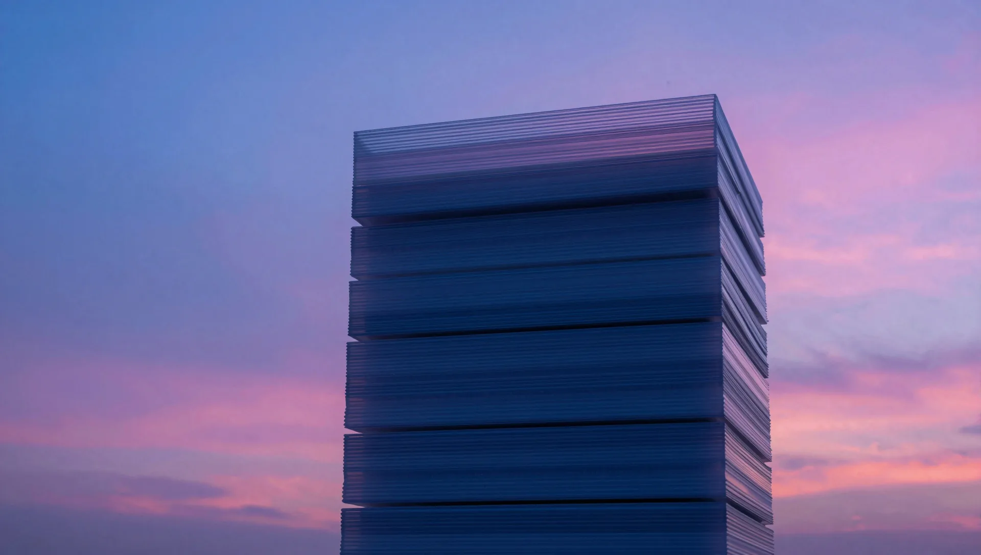 Low-angle cinematic view of a translucent layered stack against a deep electric-blue sky