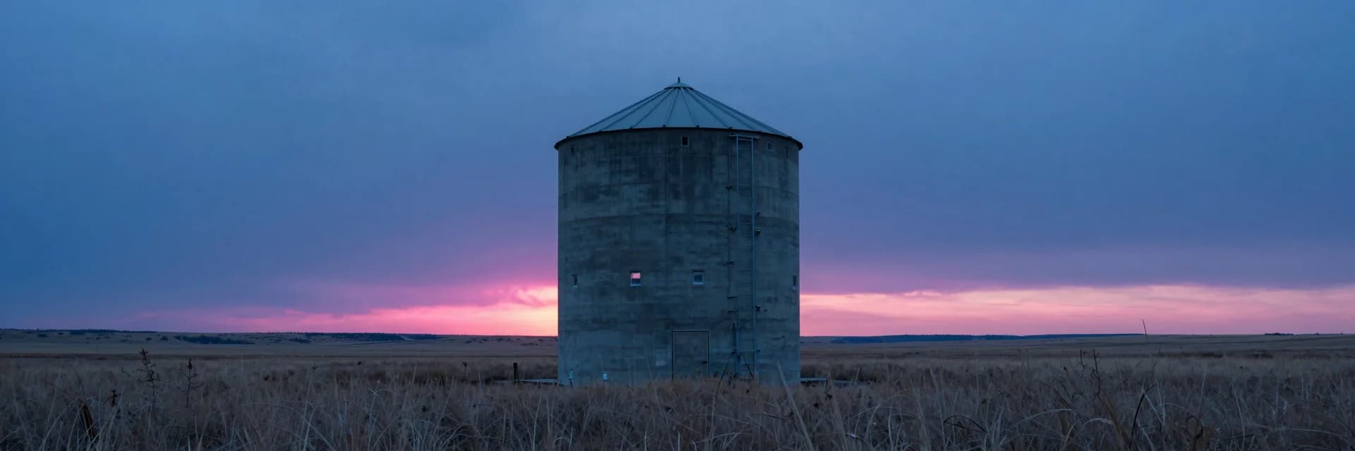 ultra-wide strip of lone industrial silhouette on a prairie at hot-pink sunset - hero image for the cart abandon vs browse abandon flows guide