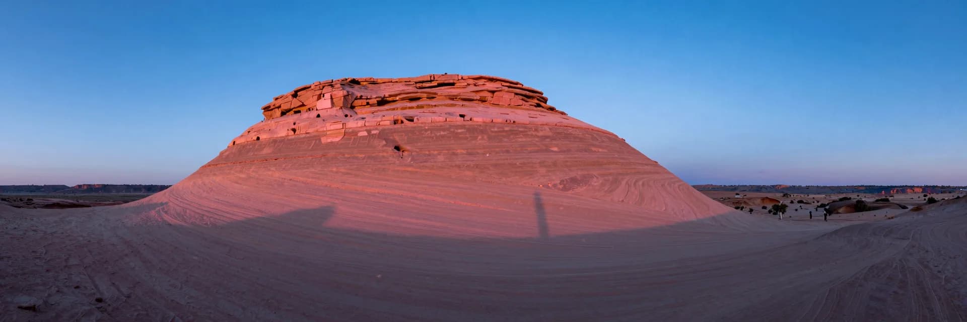 ultra-wide strip of dune ridge under electric-blue sky with hot-pink low sun grazing the crest - hero image for the design tokens that survive a rebrand guide